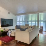 TV living room with large TV and very good sofa. There is extremely good sound with speakers integrated into the wall at the front and back, and a large Sub. Then you can fire up the wood-burning stove and enjoy delicious evenings.